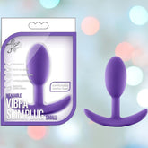 Packaging for the Luxe Wearable Vibra Slim Butt Plug - Small Size by Blush Novelties features a vibrant purple design, complemented by an image of the product. The package highlights its satin-smooth silicone, stimulating vibrations, and a comfortable anchor base for safe and pleasurable wear.